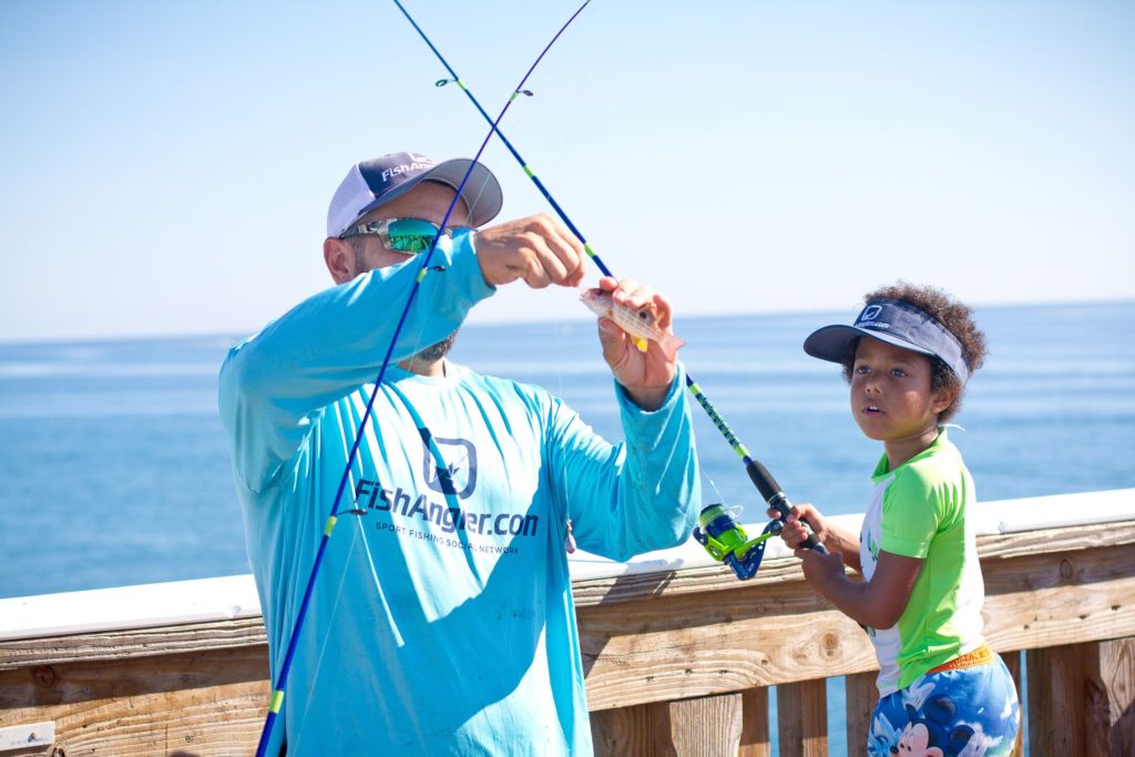 Man and child fishing from dock