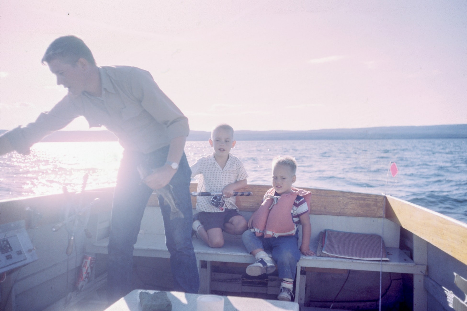 Boys fishing with their dad