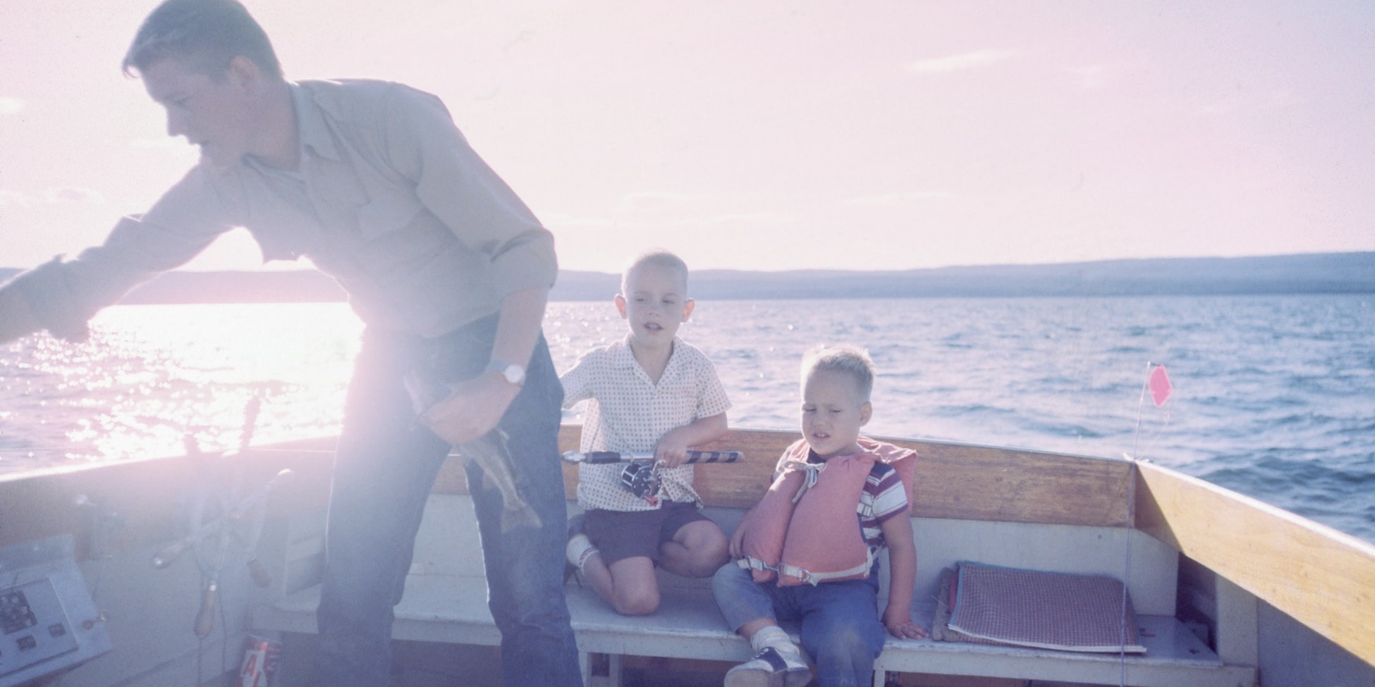 Boys fishing with their dad